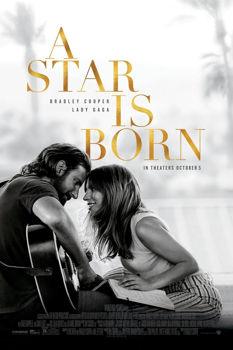 A poster for the movie A Star is Born showing a man playing a guitar and a woman looking into his eyes. 