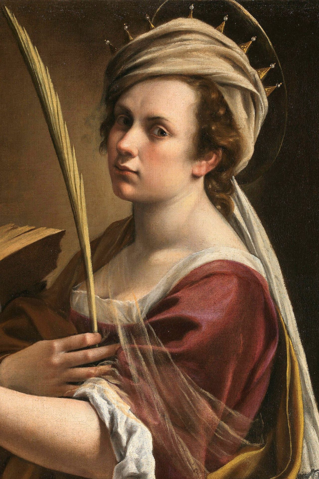 Artemisia portrays herself as Saint Catherine in the painting. She gently grasps a palm leaf in her hand, representing a Christian martyr's symbol. A somewhat translucent veil can be seen covering her chest and arm alongside the palm.